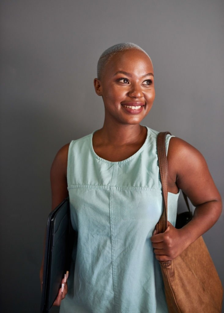 Professional with laptop bag, representing ambitious African talent ready for global partnerships
